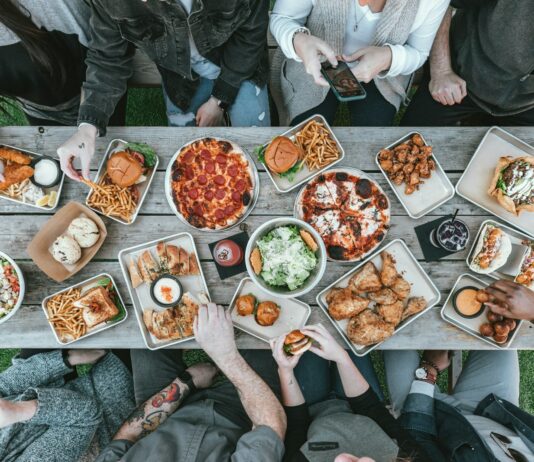 식사와 운동: 건강한 변화의 시작점 a group of people sitting around a table with food