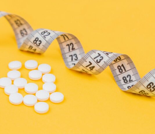 청소년 비만, 예방이 최선이다. white round medication pill on yellow surface