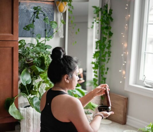 정신 건강과 운동: 우울증 완화를 위한 최적의 운동 루틴 a woman sitting on a pink mat