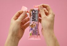 운동 후 단백질 보충의 중요성과 적절한 식단 a person holding up a pink bar of candy